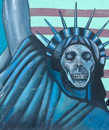 A satirical drawing of  the Statue of Liberty on the wall of the former US embassy in Tehran. Photo: The Washington Post
