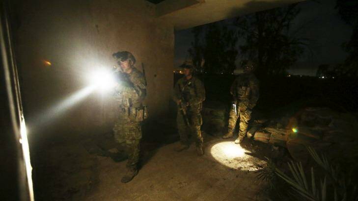 Taji Iraq: Aussie diggers clear buildings prior to the Iraqi soldiers starting their night time activities. Photo: Gary Ramage