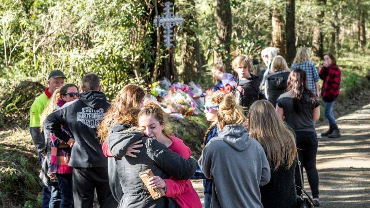 Friends grieve for the three teenagers who died in a car crash in Avonsleigh. Photo: Justin McManus