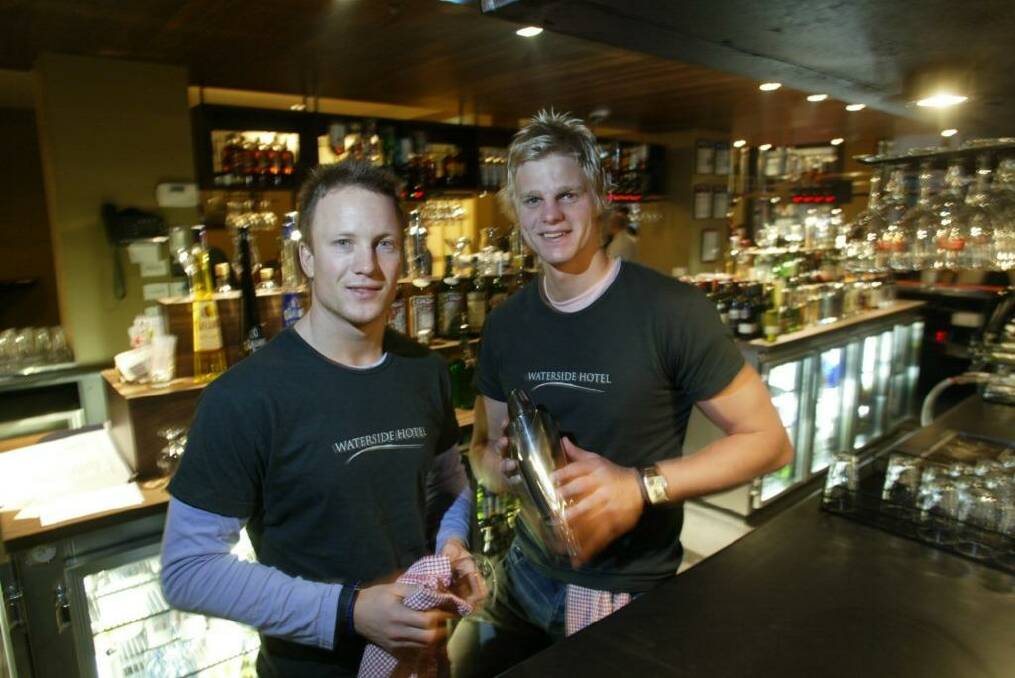 Footballers and publicans Nathan Brown and Nick  Riewoldt behind the bar at The Waterside Hotel,  Photo: Andrew De La Rue