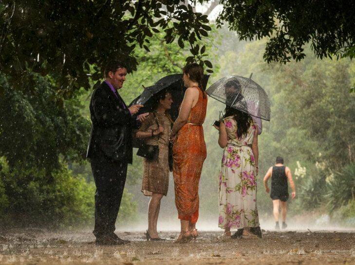 People stuck out in the pouring rain, along the Tan, Melbourne. Saturday November 18th 2017. Photo: Daniel Pockett