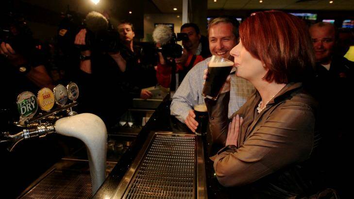 Julia Gillard sips a Tooheys Old during the 2010 campaign. Photo: Andrew Meares 