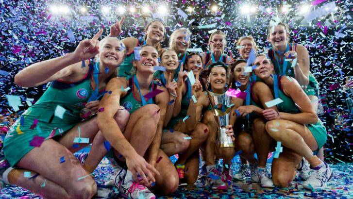 Winning formula: The Melbourne Vixens celebrate with their championship trophy. Photo: Paul Jeffers