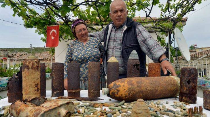 Ali Gul and his wife Gulumser Gul,Turkish farmers display their collection of military artifacts. Photo: Joe Armao