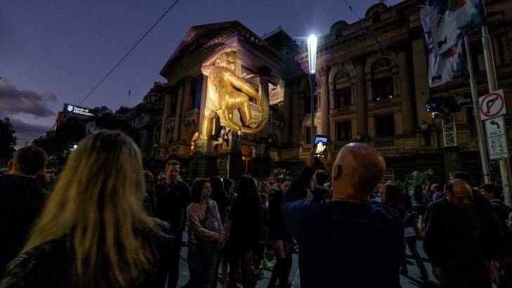 A giant golden monkey clambers up Melbourne Town Hall ... for White Night 2016. Photo: Luis Ascui