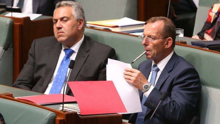 Backbenchers Tony Abbott and Joe Hockey stay on top of the paperwork during question time. Photo: Andrew Meares