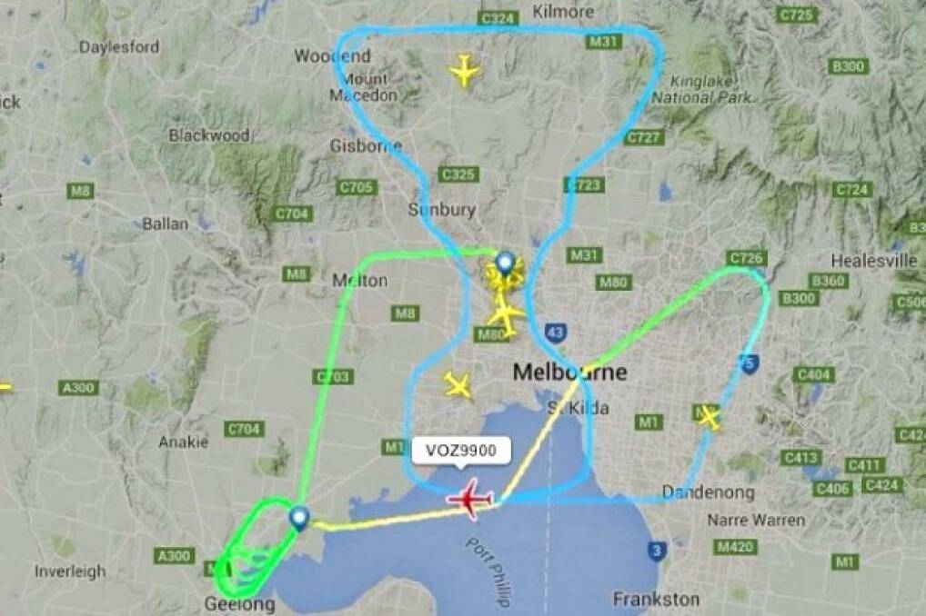 It took three pilots 32 minutes to "draw" the AFL premiership cup over Melbourne on grand final day.
