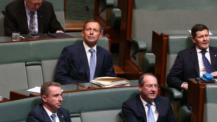 Former prime minister Tony Abbott and former defence minister Kevin Andrews take their seats on the backbench for question time. Photo: Alex Ellinghausen