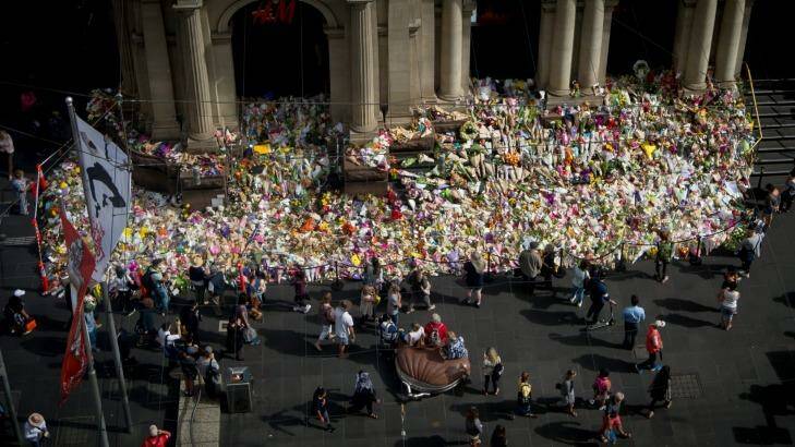 The tribute to victims of the Bourke Street rampage grows on the steps on the GPO. Photo: Penny Stephens