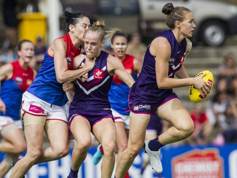 The Dockers have notched a five-point victory over AFLW flag fancies Melbourne at Fremantle Oval.