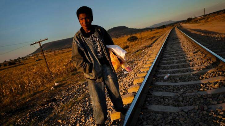 A Guatemalan asylum seeker waits on railroad tracks to climb on a cargo train bound for Mexico and the US.  Photo: Jan Sochor