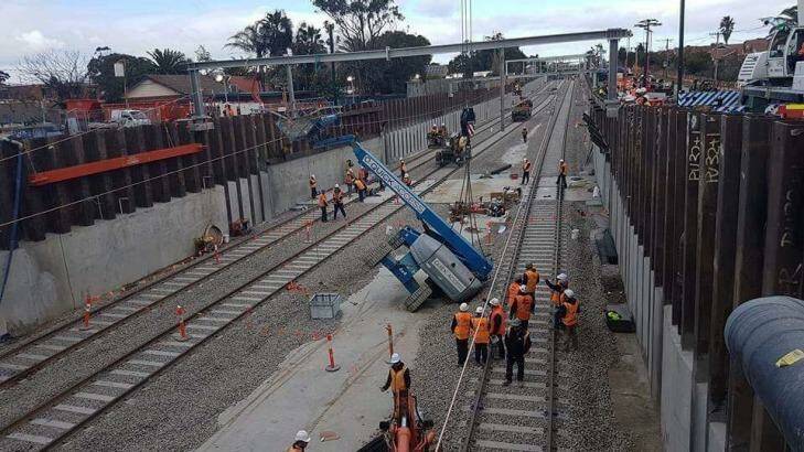 A lift working on overhead wires near Bentleigh railway station toppled over Monday. No one was injured in the incident.  Photo: Supplied