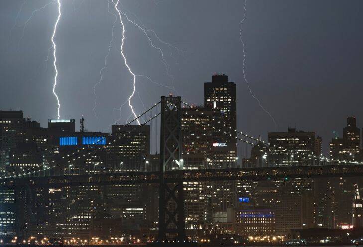 Seen from Oakland, Calif., lightning forks over the San Francisco skyline on Monday, Sept. 11, 2017. (AP Photo/Noah Berger)