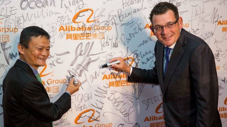 Writing on the wall: Alibaba founder Jack Ma with Premier of Victoria Daniel Andrews at the launch of Alibaba's Australian and New Zealand headquarters. Photo: Stefan Postles