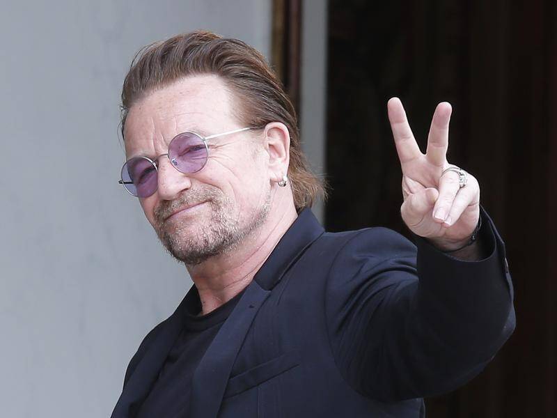 U2 frontman Bono has apologised after workers at his charity in Johannesburg said they were bullied.