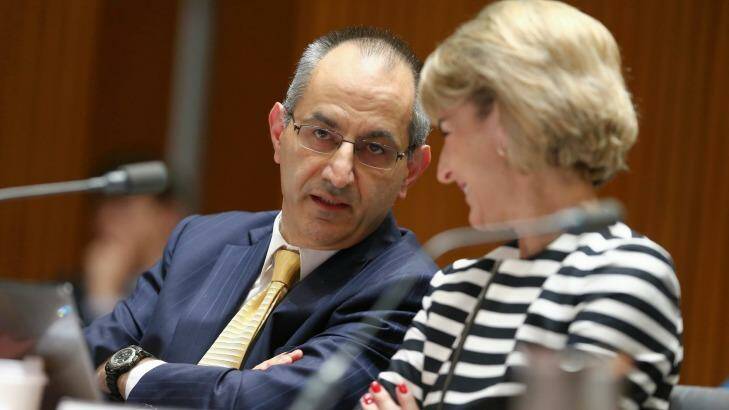 Secretary of the Department of Immigration and Border Protection Michael Pezzullo and Senator Michaelia Cash in discussion during estimates on Monday. Photo: Alex Ellinghausen