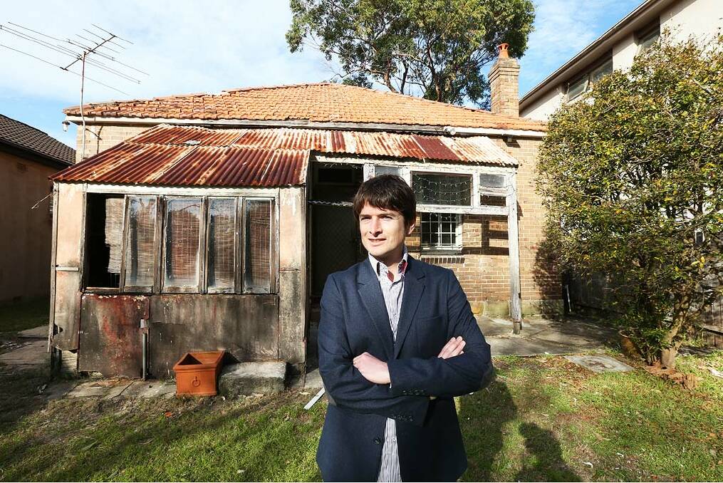 Falling down: Rob Rawson at the back of his Roe Street, Bondi property, where the old back shed will be demolished. Photo: Peter Rae.