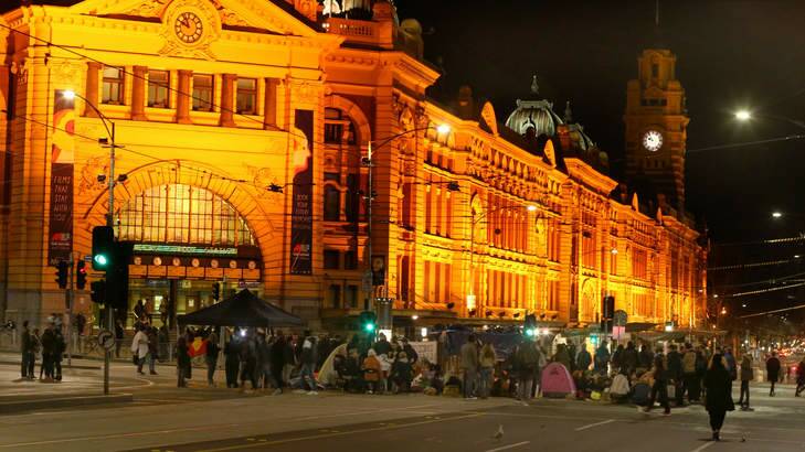 The intersection of Flinders and Swanston streets was blocked late into the night by demonstrators protesting the treatment of Indigenous youth in detention. Photo: Wayne Hawkins