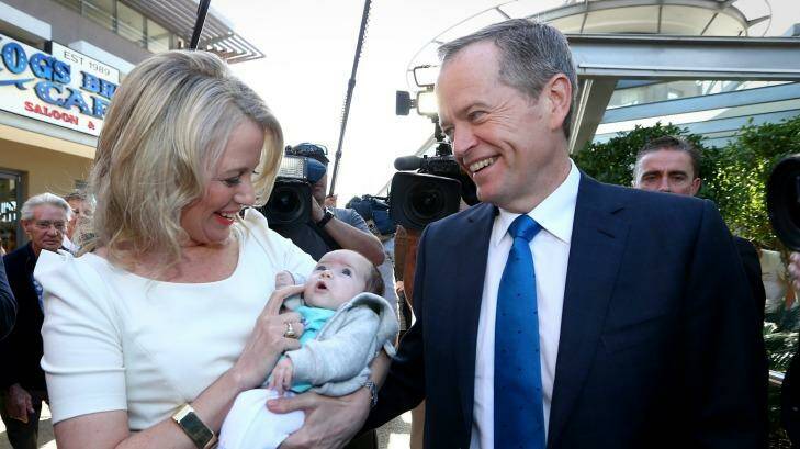 Opposition Leader Bill Shorten and Chloe Chorten meet with 6-week-old baby Lexi-Rose during a street walk in Queensland. Photo: Alex Ellinghausen
