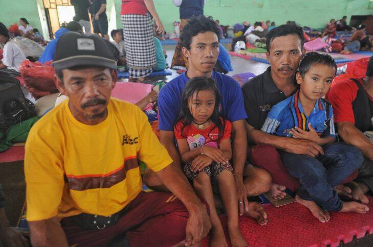 Kadek Nadi and his Family and his grandfather Wayan Pugeng, evacuees from Mount Agung, since two days ago. Bali, Indonesia. 23rd September 2017. photo credit: Alan Putra