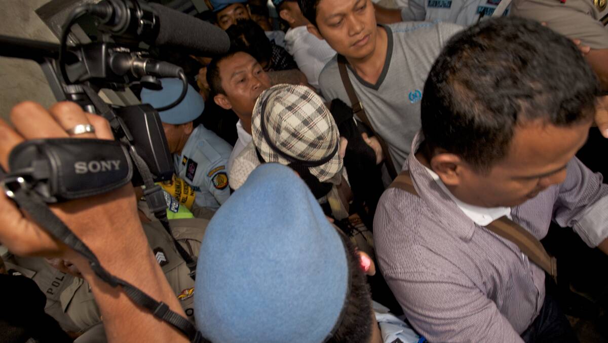 Schapelle Corby is led through the media pack as she leaves Kerobokan Prison. Photo: JUSTIN McMANUS