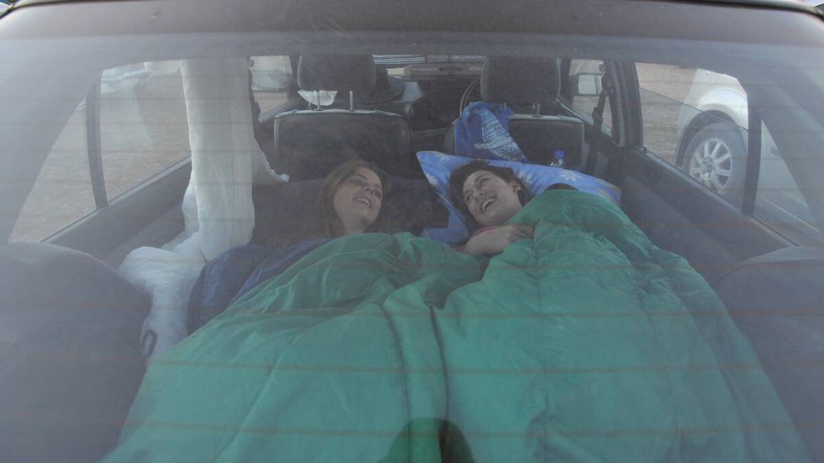 Naomi Snowball and Madeleine Powley enjoyed sleeping in their Ford Laser.

Picture: JIM ALDERSEY