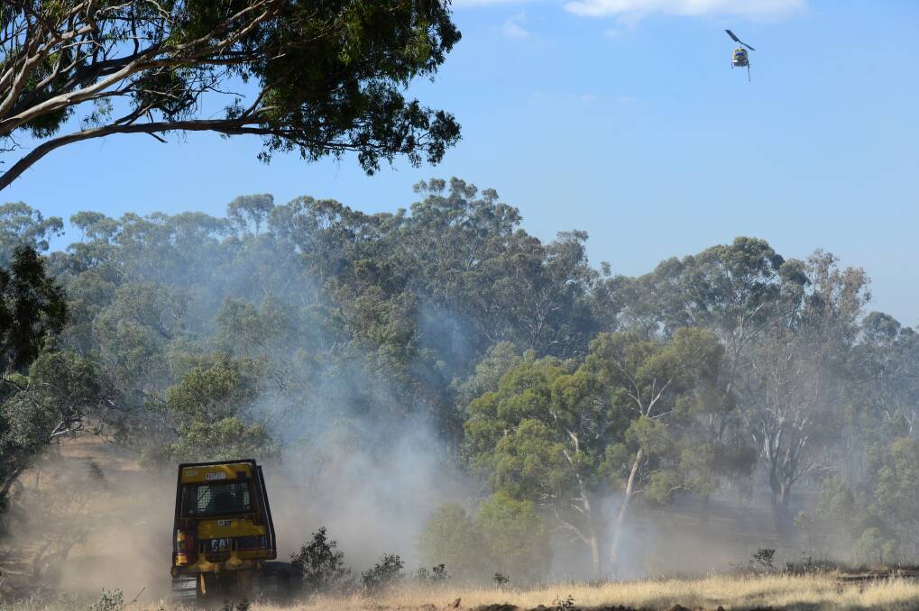 The CFA along with air support fight the fire in Lyell Road fire in Lyal, near Redesdale.

Picture: JIM ALDERSEY
