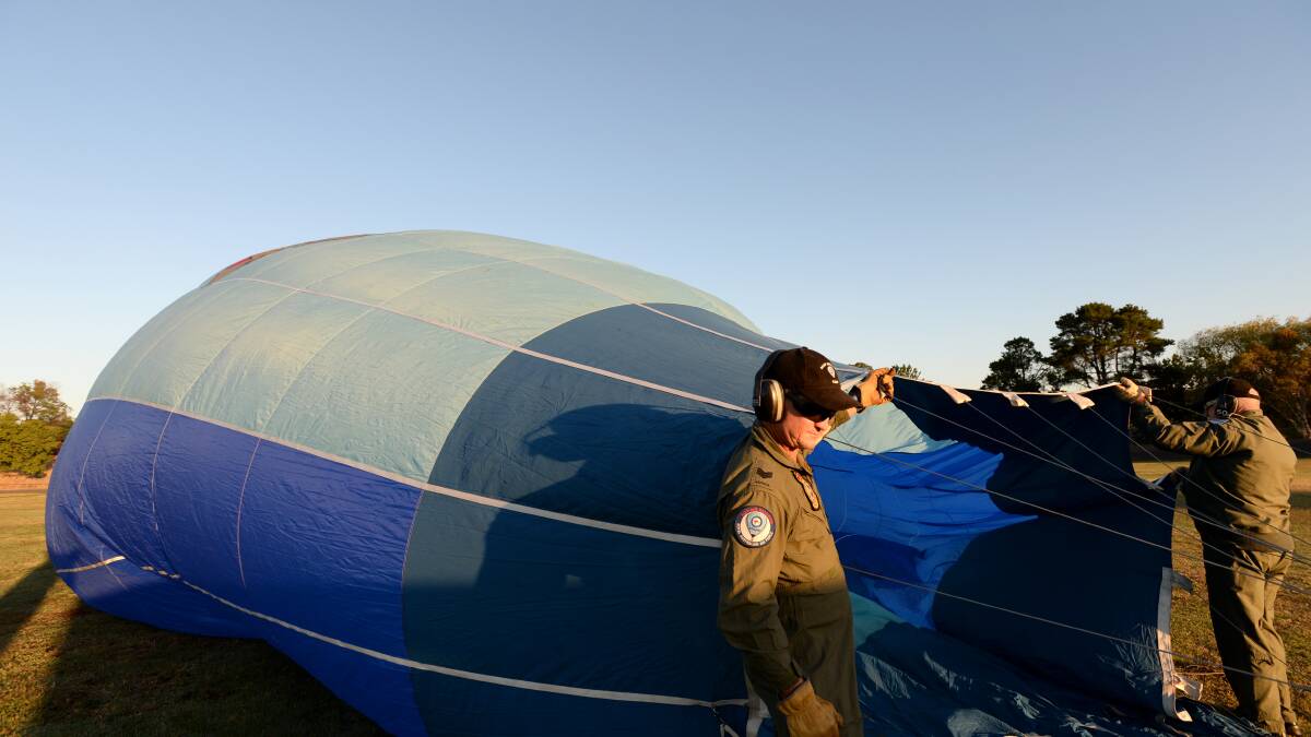 The crew inflate the balloon. 

Picture: JODIE DONNELLAN 