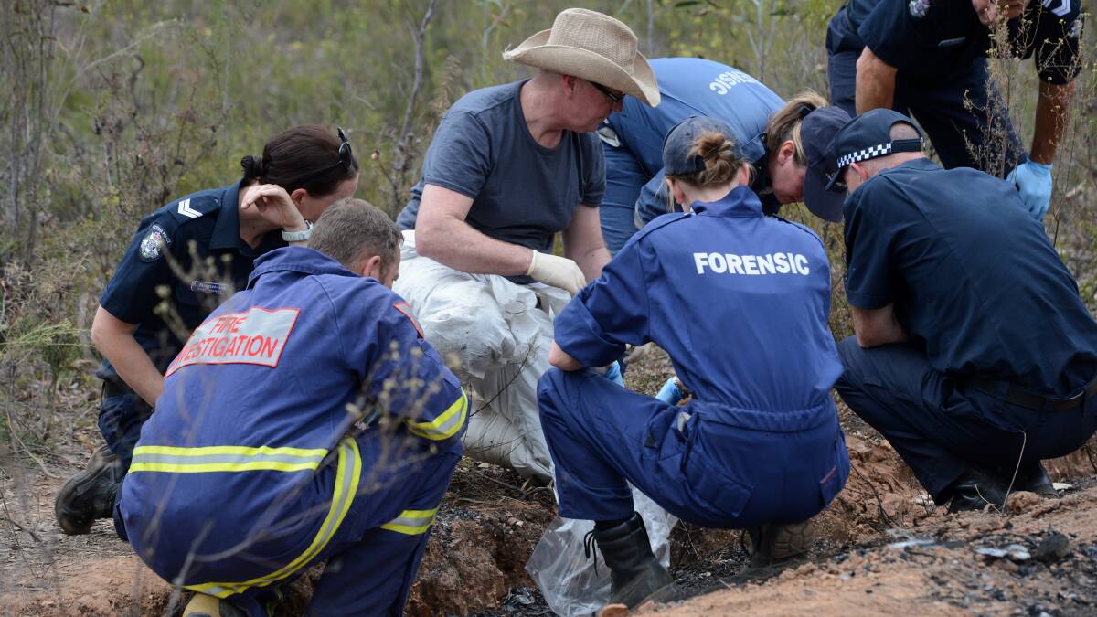 Homicide Detectives at the scene in the Wellsford Forest where human remains were found in the boot of the car.

Picture: JIM ALDERSEY
