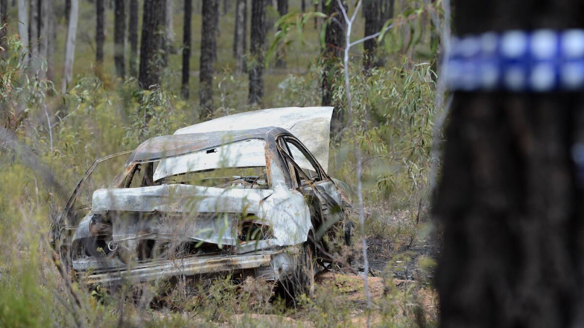 Homicide Detectives at the scene in the Wellsford Forest where human remains were found in the boot of the car.

Picture: JIM ALDERSEY