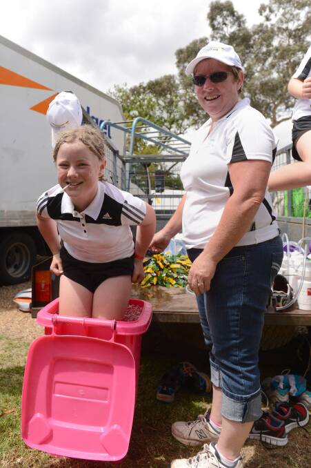 Julie sides gives daughter Meg a hand with the ice bath during the RACV Energy Breakthrough in Maryborough.

Picture: JIM ALDERSEY