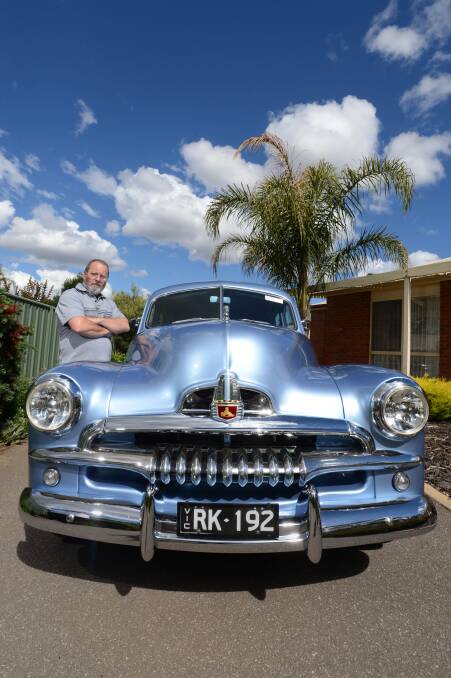 Rick Kingsley with his Blue FJ Holden, this FJ was Rick's first car. He is disapointed that the car manufaturer is closing down production in 2017.

Picture: JIM ALDERSEY
111213