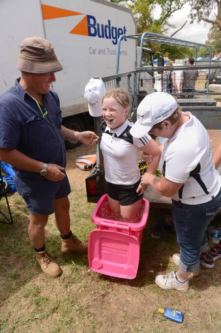 Rob and Julie sides give daughter Meg a hand with the ice bath during the RACV Energy Breakthrough in Maryborough.

Picture: JIM ALDERSEY
