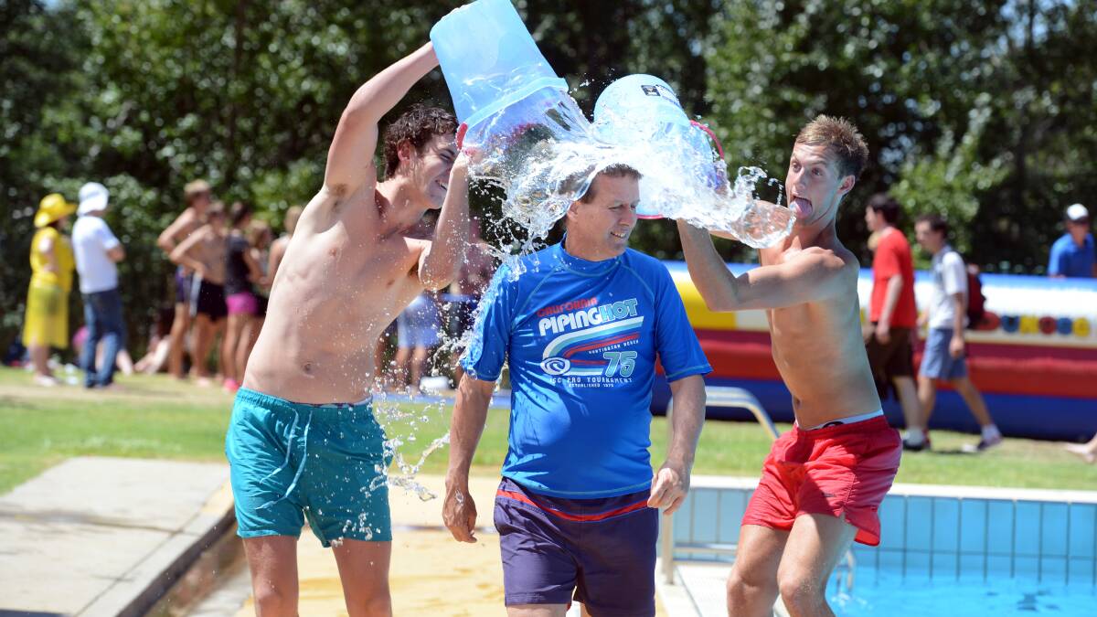 Bendigo Senior Secondary College principal Dale Pearce is cooled down by two students at the school swimming sports day.

Picture: Jim Aldersey
050213