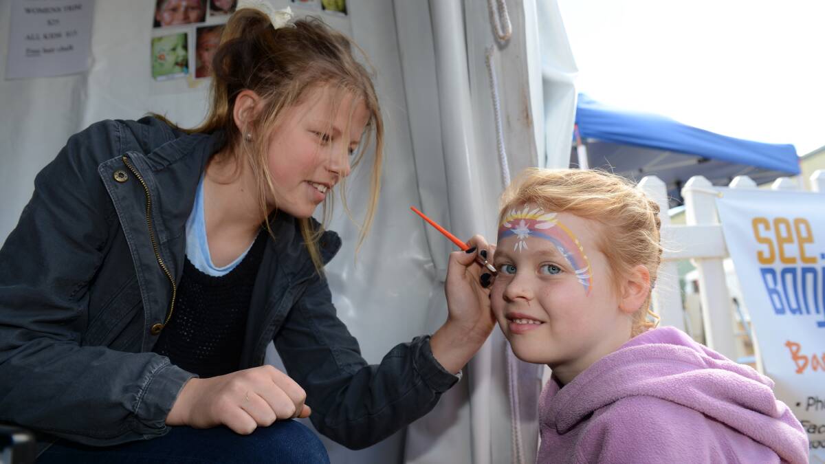 Nicole Ford helps out at the See Banjo run tent by painting Matilda Nevill's face at day 1 of the Elmore Field Days.

Picture: JIM ALDERSEY