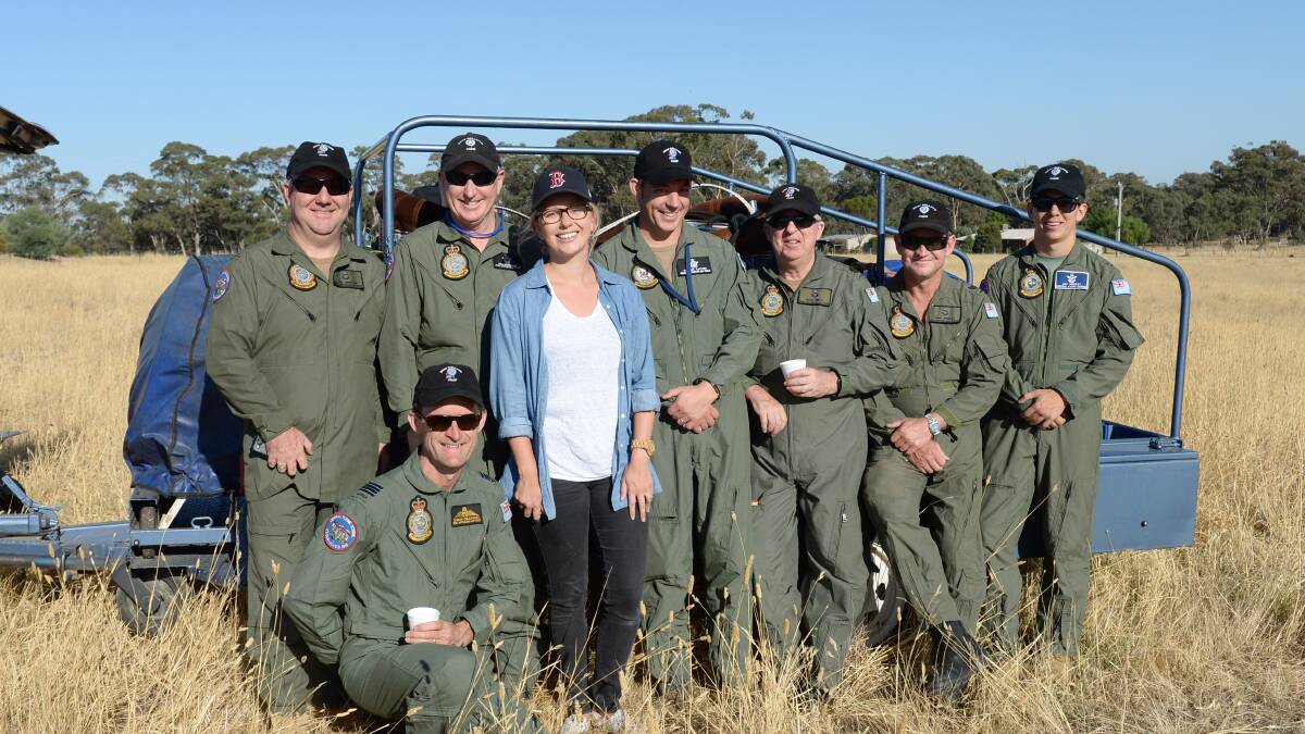 Pilot Damian Gilchrist (front) with Bendigo Advertiser photographer Jodie Donnellan and RAAF balloon crew Phil Simmons, Steve Mountstephen, Nathan Layton, Peter Smith, Chris Bradley and Jay Murray. 

Picture: JODIE DONNELLAN 