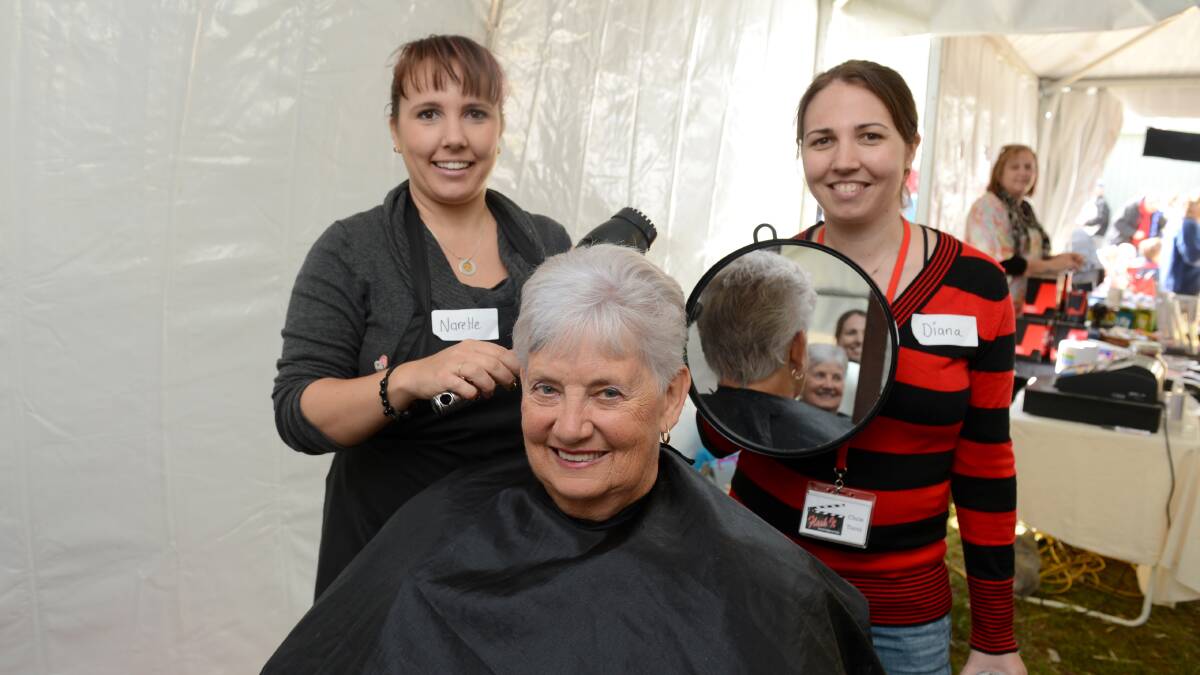 Athalie Ayson has her hair cut by Narelle Robertson and Diana O'Brien at the See Banjo Run tent at day 1 of the Elmore Field Days.

Picture: JIM ALDERSEY