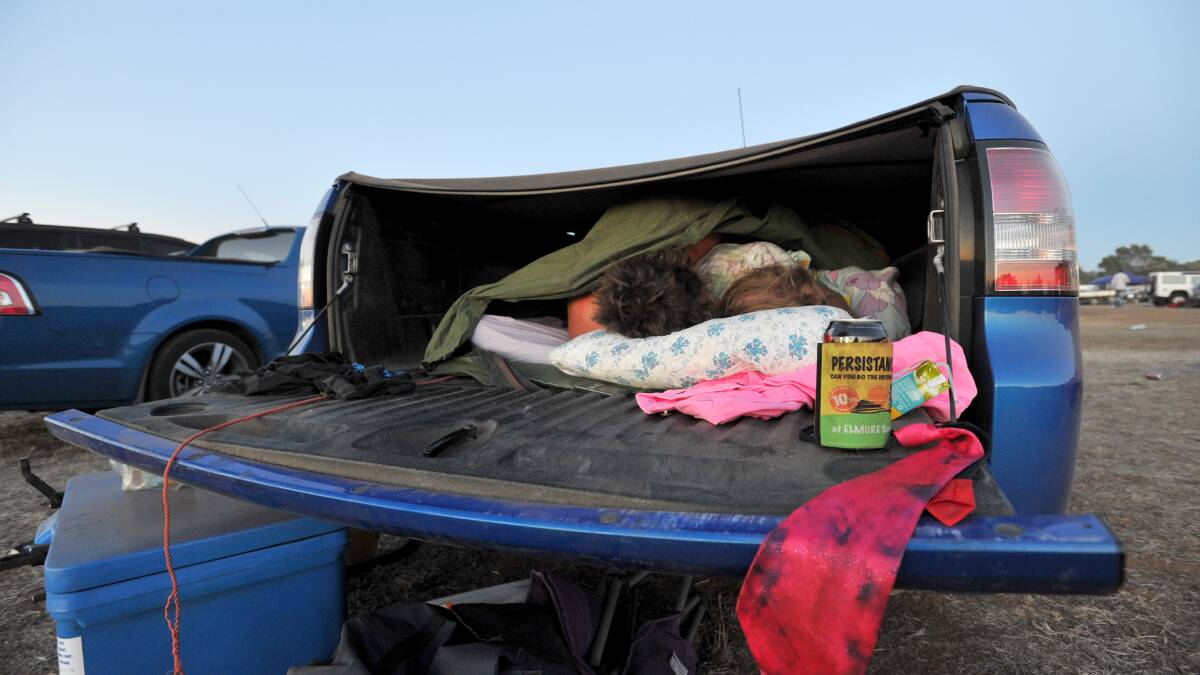 Revellers enjoy the comforts of sleeping in the back of a ute.

Picture: JIM ALDERSEY