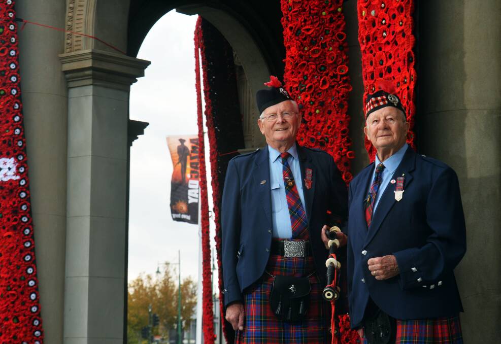 WELL TRAVELLED: Wally Stables and Bruce Heider of Bendigo Highland Pipe Band. Picture: BRENDAN McCARTHY