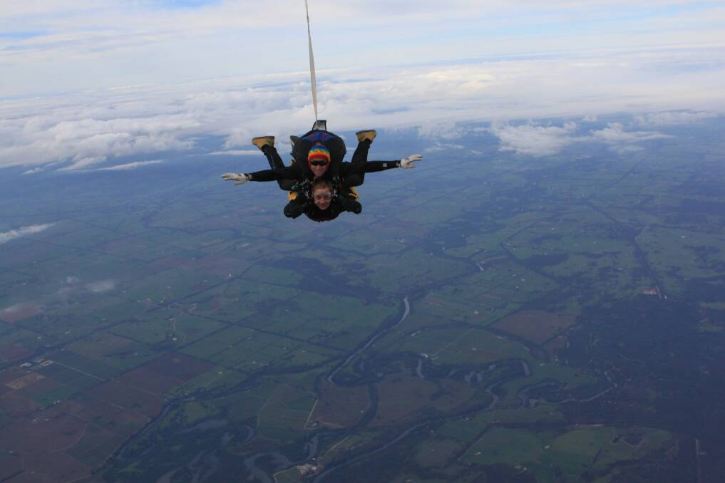 BIG JUMP: Dean McDonald and Lisa Greenwood complete the skydive. 