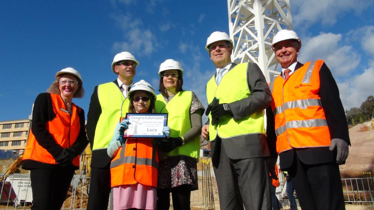 CRANE: Victoria Scicluna with Minister for Health David Davis at the new hospital site. Picture: LEIGH SHARP