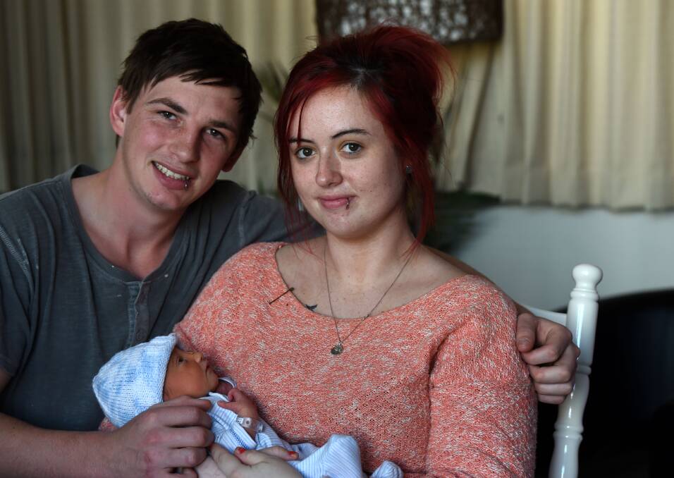 HAPPY: Louie Thomas and Eden Phillips with baby Levi who was born on Monday. Picture: JODIE DONNELLAN 
