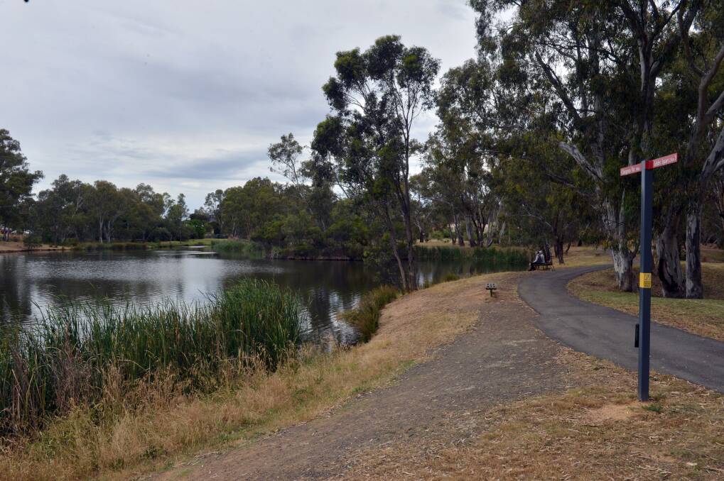 SEARCH: Police divers have searched the lake at the Rotary Gateway Park in Kangaroo Flat. 