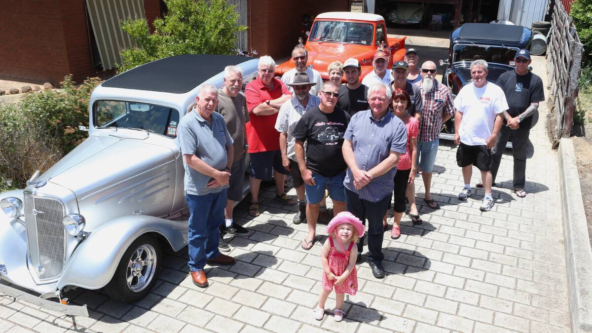 CAR ENTHUSIASTS: Kev's Hot Rod Breakfast participants with their prized cars. Pictures: PETER WEAVING