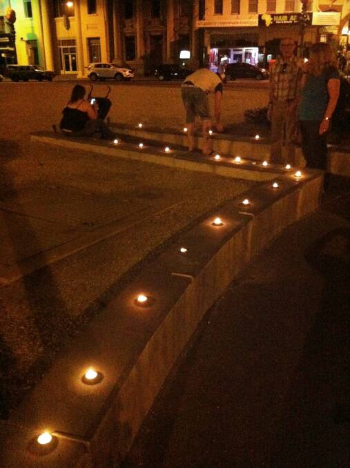 TRIBUTE: People light candles to remember Patiya. Picture: CONTRIBUTED
