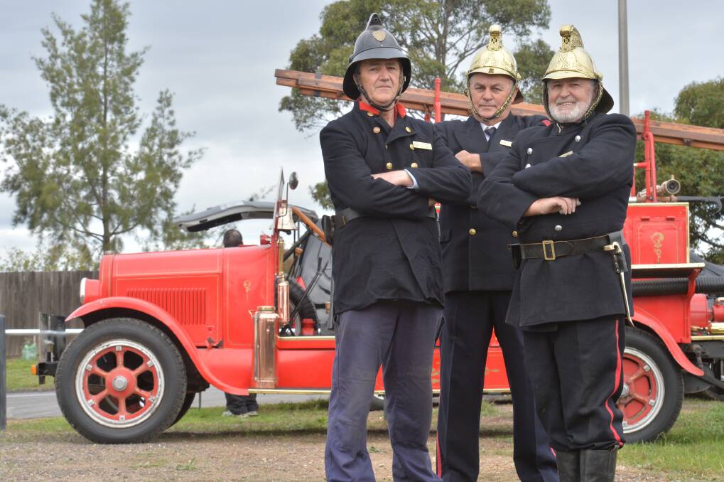 PLAY THE PART: Terry Widdows, Doug Murley and John White of the Central Victorian Fire Service Preservation Society with a 1923 fire engine. Picture: BRENDAN McCARTHY
 Picture: BRENDAN McCARTHY