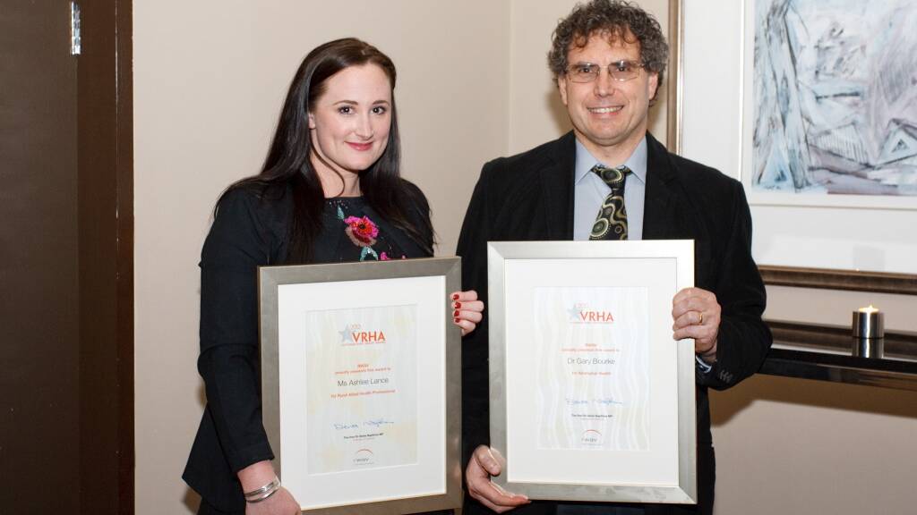 HIGH ACHIEVERS: Ashlee Lance and Dr Gary Bourke with their awards. 