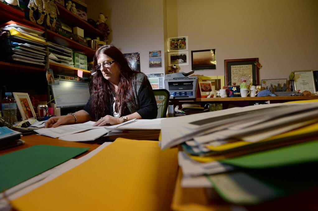 BUSY: Jenny Elvey reads up on the Federal Budget. Picture: JIM ALDERSEY
