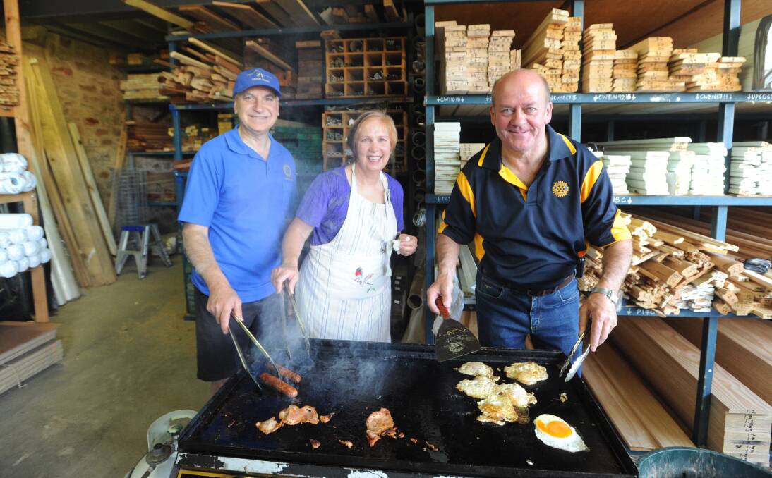 Volunteers Vin Cappy, Christine Barkla and Bill Maltby at the Save Your Bacon breakfast. Picture: JODIE DONNELLAN

