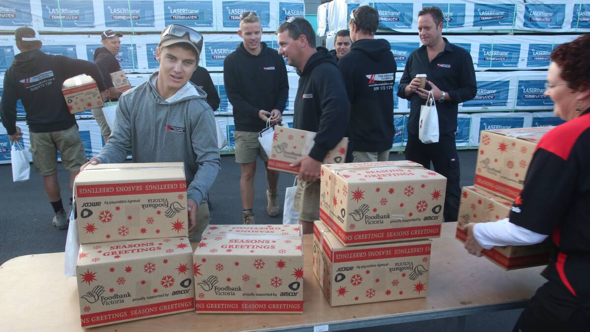 FREE: Tradies make the most of the Bendigo foodshare parcels. Picture: PETER WEAVING